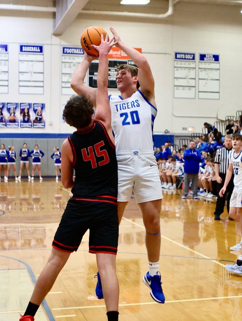 Princeton senior Arthur Burden shoots  over Erie-Prophetstown's Gus Schultz Friday night at Prouty Gym.
