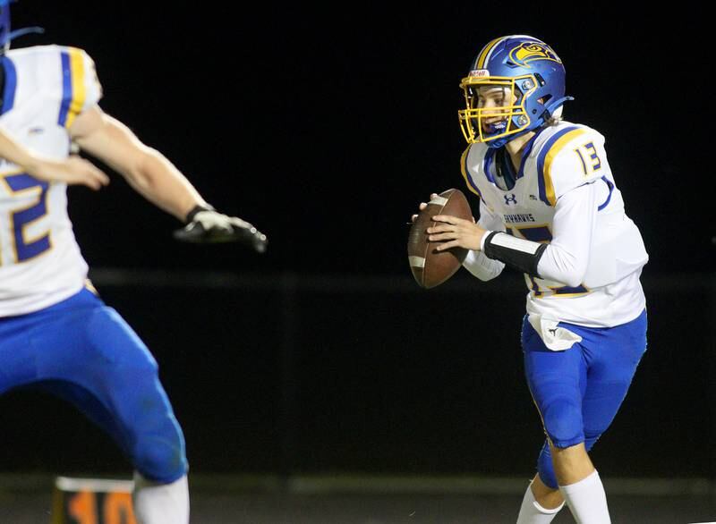 Johnsburg’s Carter Block looks for an option in varsity football on Friday Sept. 27, 2024, at Woodstock North High School in Woodstock.
