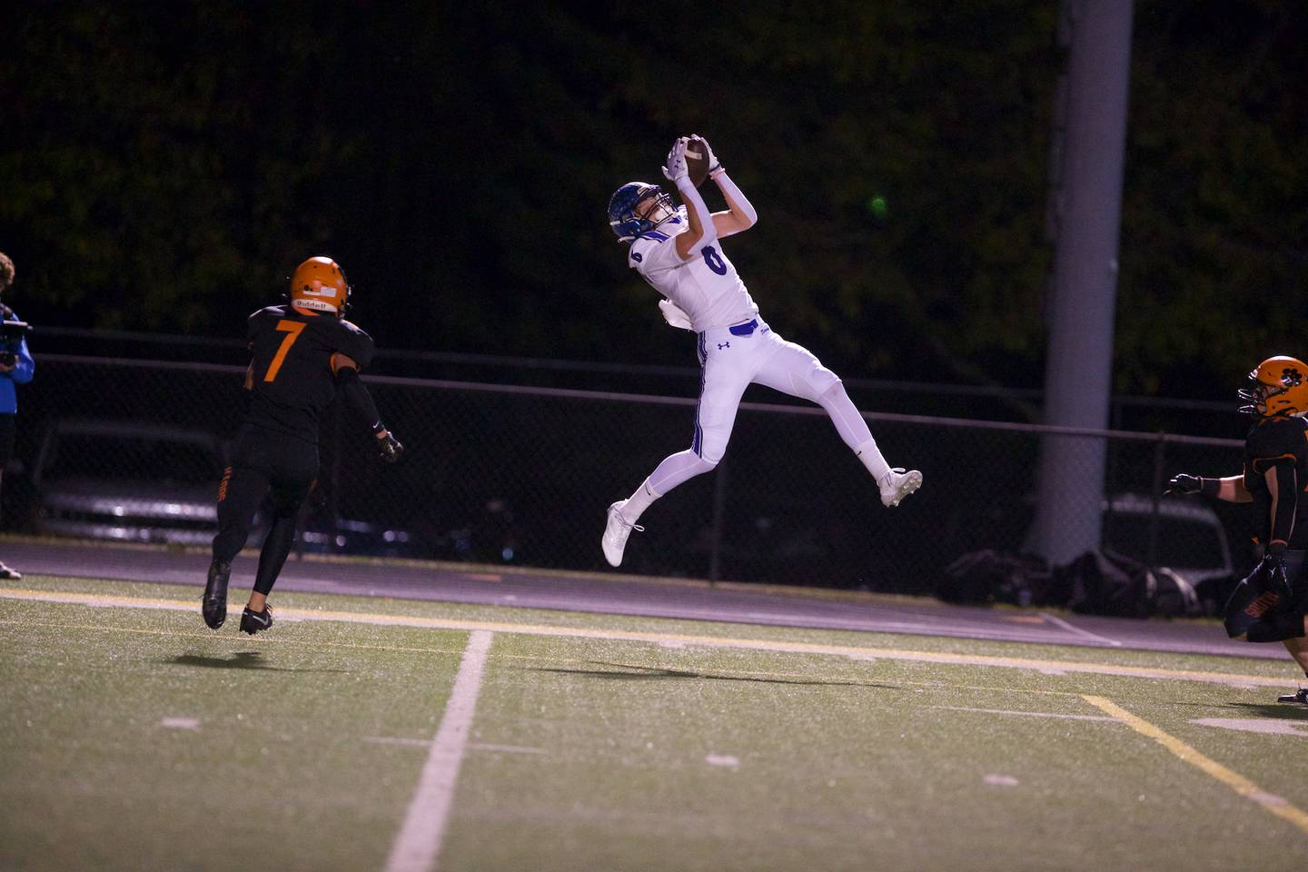 St. Charles North's Keaton Reinke makes the jumping catch against Wheaton Warrenville South on Friday, Oct. 10, 2025 in Wheaton.