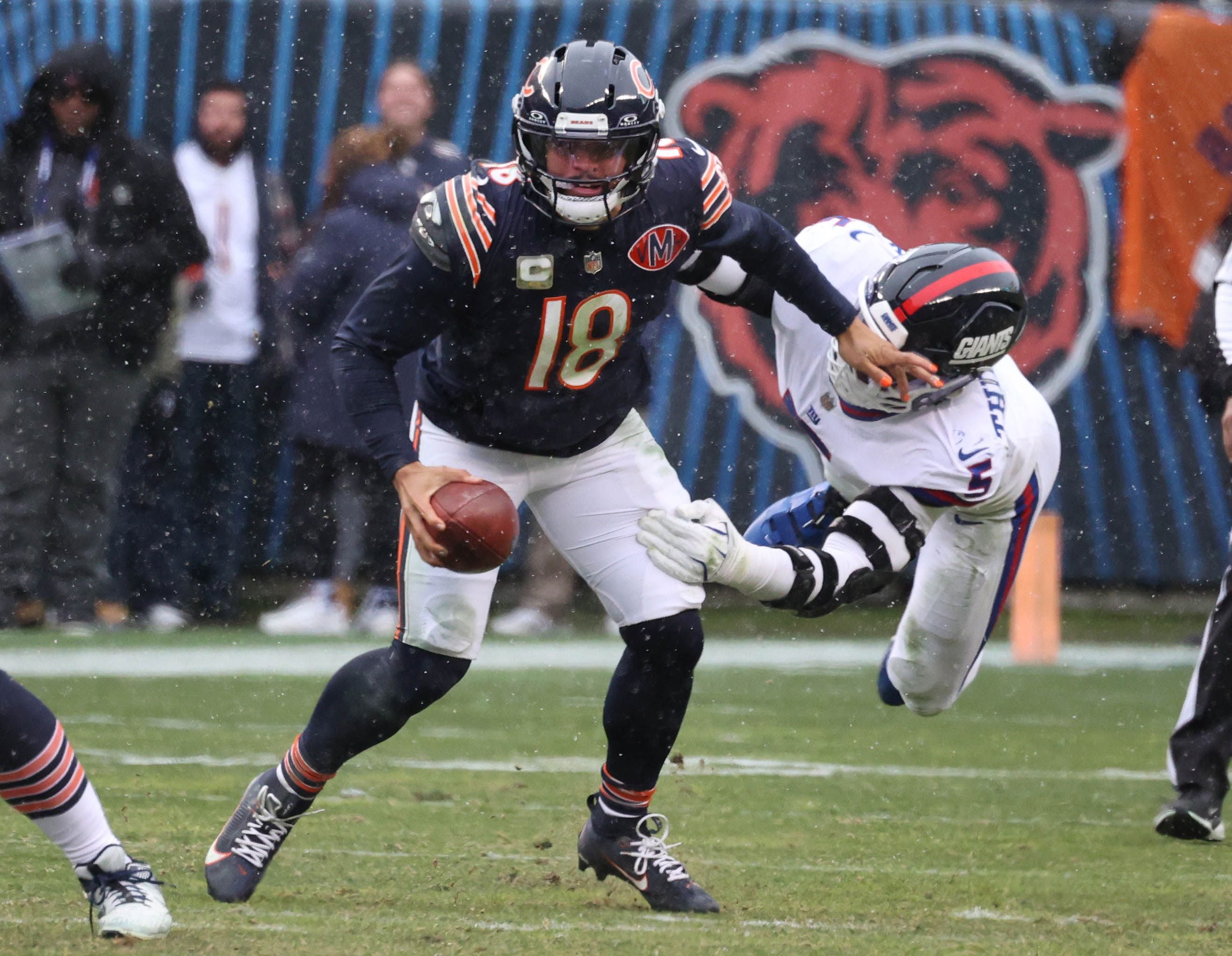 Chicago Bears quarterback Caleb Williams escapes New York Giants linebacker Kayvon Thibodeaux Sunday, Nov. 9, 2025, during their game at Soldier Field in Chicago.