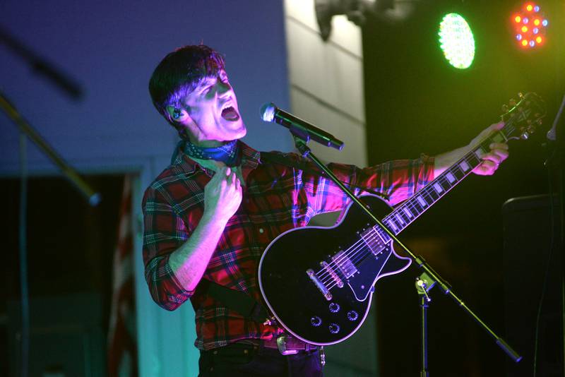 The lead singer for Fortunate Sons, a Creedence Clearwater tribute band, sings during the Jamboree Concert Series in Mt. Morris on Friday, Aug, 29, 2025.