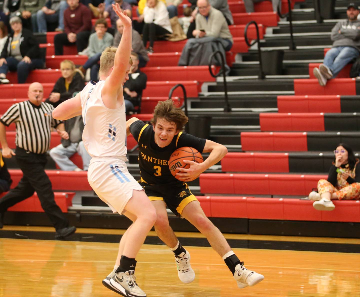 Putnam County's Bryce Smith tucks the ball while trying to get around Bureau Valley's Bryce Helms during the 49th annual Colmone Class on Thursday, Dec. 7, 2023 at Hall High School.