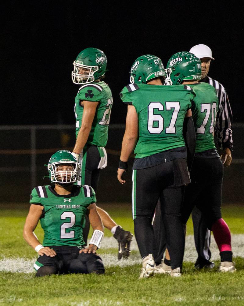 Gunnar Varland (2) of Seneca on his knees stares off in distance after being sacked on Friday, Oct. 10, 2025 at Seneca High School in Seneca.
