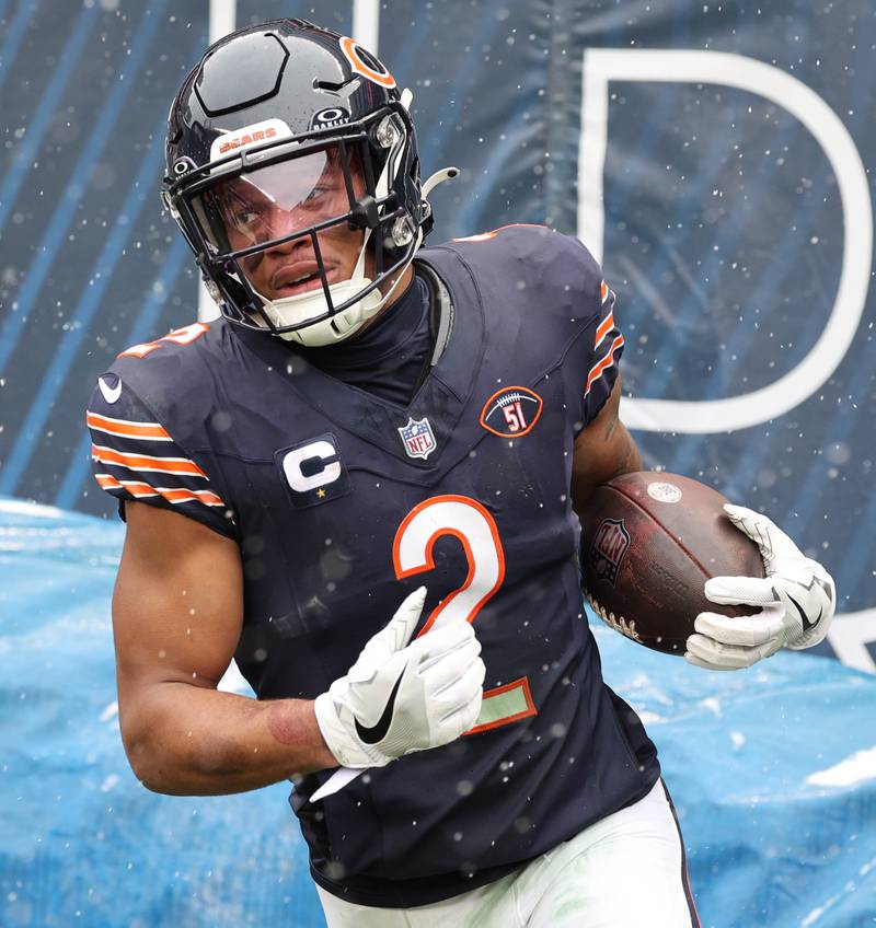 Chicago Bears wide receiver DJ Moore runs out of bounds after a catch during their game Sunday, Dec. 31, 2023, at Soldier Field in Chicago.