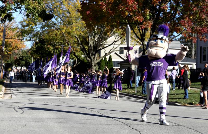 The Downers Grove North mascot leads the marching band on Friday, Oct. 18, 2024 during the school’s annual homecoming parade.
