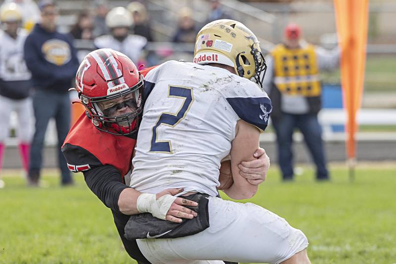 Amboy’s Landon Montavon takes down Hiawatha’s Blake Wiegartz for a loss Saturday, Oct. 28, 2023 in the I8FA playoffs in Amboy.