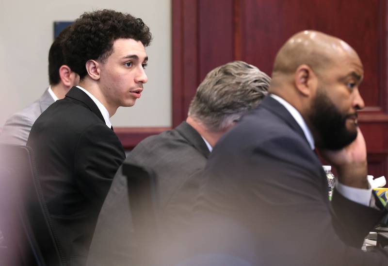 Hamza Khatatbeh, 17, (left) formerly of Sycamore, and his defense team Jim Ryan and Brandon Brown, (right) listen to testimony Wednesday, Feb. 18, 2026, during his murder trial at the DeKalb County Courthouse in Sycamore. Khatatbeh is accused of fatally stabbing Sycamore 17-year-old Kaleb McCall in 2023.