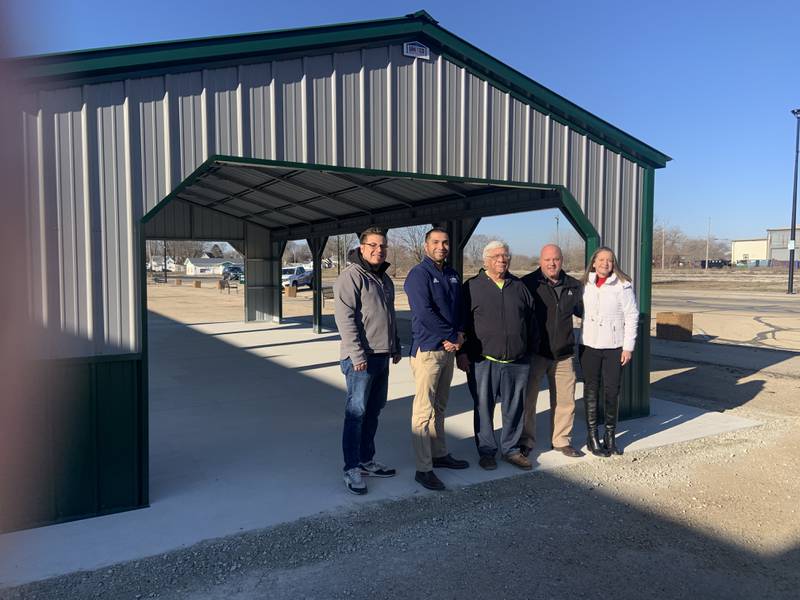 United Metal Buildings of Sterling-Rock Falls donated a new pavilion for Firehouse Ministries and the Rock Falls Farmers Market at 403 W. Second St. in Rock Falls. Pictured are Jaime Cendajas, outside sales representative of United Metal Buildings; Juan Moreno, general manager of United Metal Buildings; Rock Falls Mayor Rod Kleckler; and Brian and Elizabeth Tribley of Firehouse Ministries.