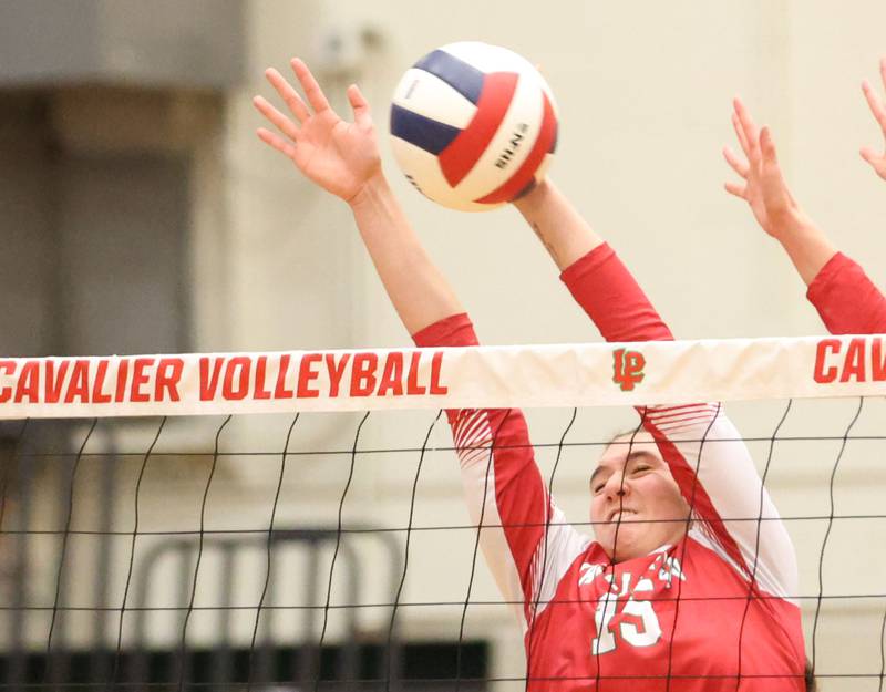 L-P's Drew Depenbrock blocks a spike during the Class 3A Sectional semifinal game on Tuesday, Nov. 4, 2025 in Sellett Gymnasium at L-P High School.