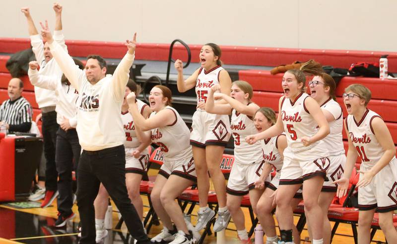 Hall coach TJ Orlandi and players react after teammate Caroline Morris sinks the game winning shot over Princeton on Monday, Jan. 6, 2025 at Hall High School.