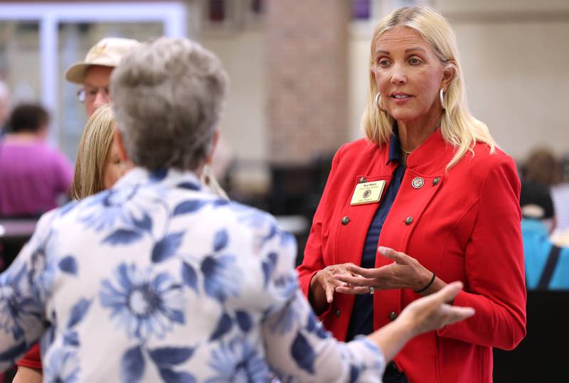 State Sen. Sue Rezin, R-Morris, one of the hosts of the event, visits with a vendor during a senior health fair Wednesday, July 12, 2023, at DeKalb High School.