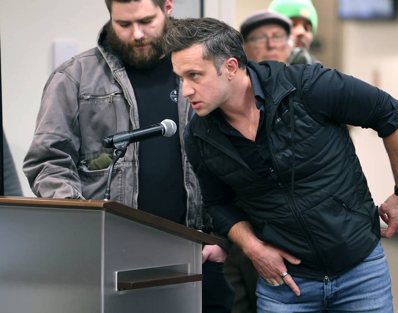 James Feasey, senior director of AI Infrastructure at Endeavour, answers a citizen’s question Monday, Dec. 1, 2025, during public comment, about the proposed 560-acre Endeavour Energy data center at the Planning and Zoning Commission hearing at the DeKalb Public Library.