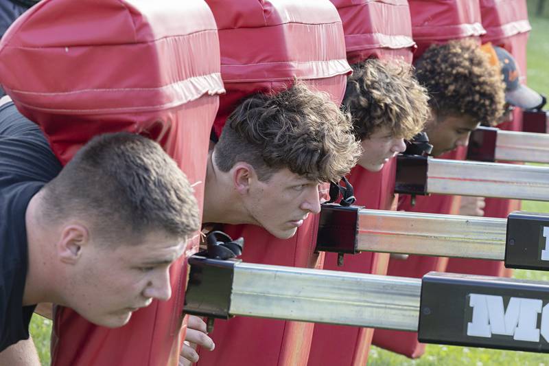 The Morrison football team goes through workouts during a camp Tuesday, July 25, 2023. The Mustangs will open their season against Mendota at the end of August.
