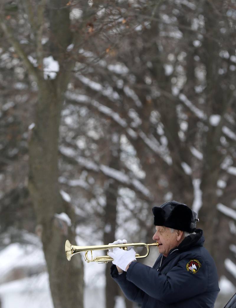 Ron Bykowski plays “Taps” during McHenry's Wreath Laying Ceremony in honor of fallen veterans on Friday, Dec. 5, 2025, at St. Mary's Catholic Cemetery in McHenry. The event was hosted by McHenry American Legion Post 491 and Team Home Depot.