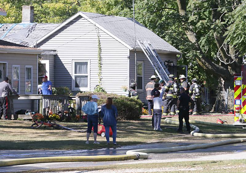 Ottawa, Naplate and Wallace firefighters work the scene of a house fire at 1529 Sycamore Street on Monday, Oct. 3, 2022 in Ottawa. The fire began shortly before 2p.m.