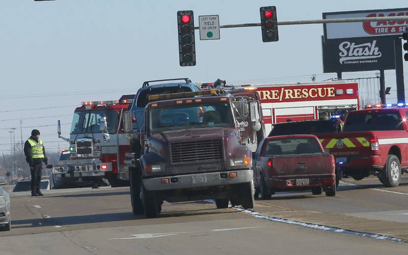 Peru Police, Fire and EMS work the scene of a two-vehicle crash at the intersection of Illinois Route 251 and 38th Street in Peru. The crash happened shortly after noon.