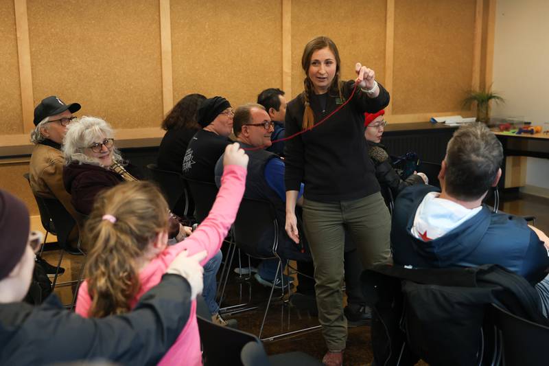 A volunteer uses a string to show the wing span of a Little Eagle during a alon Talk educational class at Four Rivers Environmental Education Center’s annual Eagle Watch on Saturday, Jan 10, 2026 in Channahon.