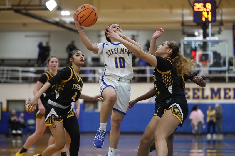 Joliet Central’s Elena Moody goes in for the layup against Joliet West on Thursday, Jan. 15, 2026 in Joliet.