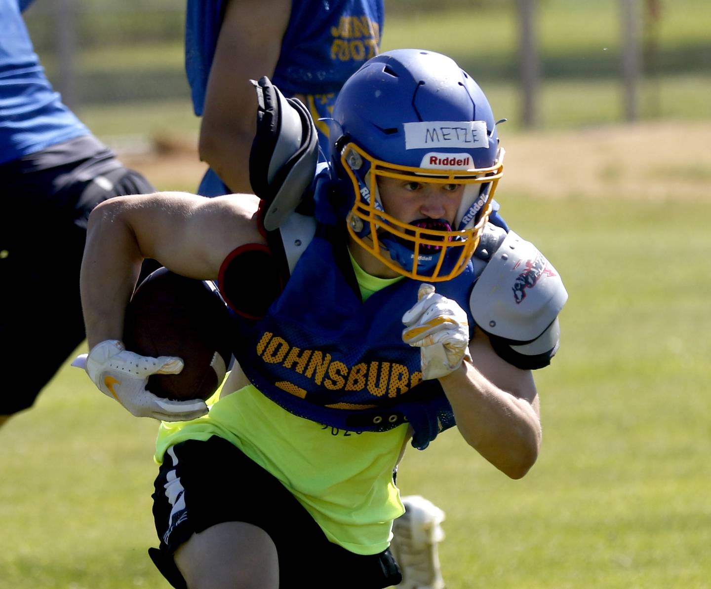 Jake Metze runs with the ball during summer football practice Thursday, June 23, 2022, at Johnsburg High School in Johnsburg.