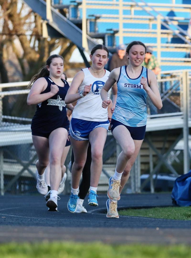 Bureau Valley's Emma Muscche and Princeton's Avery Waca make the turn in the 800 meters in Tuesday's Howard-Monier Invite at Princeton. Muscche placed second and Waca third behind Kennady Anderson of Annawan-Wethersfield.