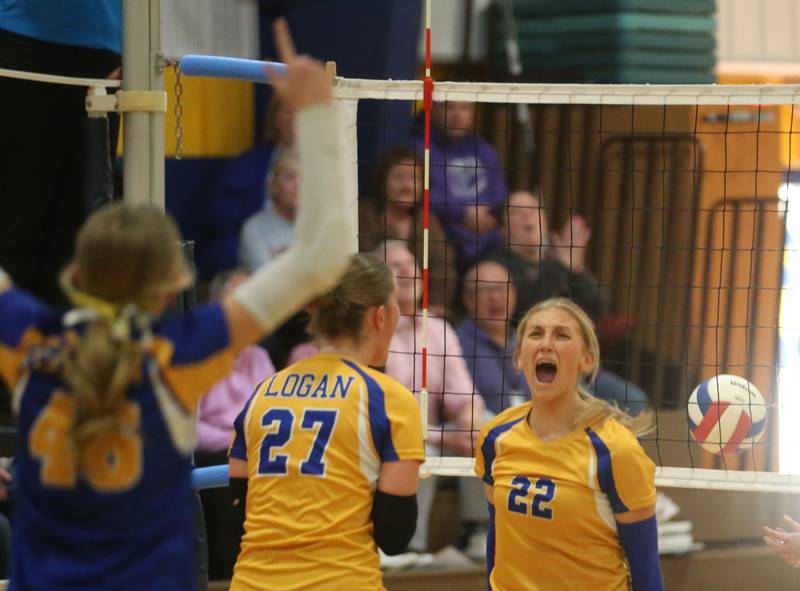 Logan's Ava Munson (22) reacts with teammates Kolbi Lawson and libero Breelyn Unthank during the IESA Class 3A eighth-grade Regional final game on Thursday, March 13, 2025 at Logan Junior High School in Princeton.