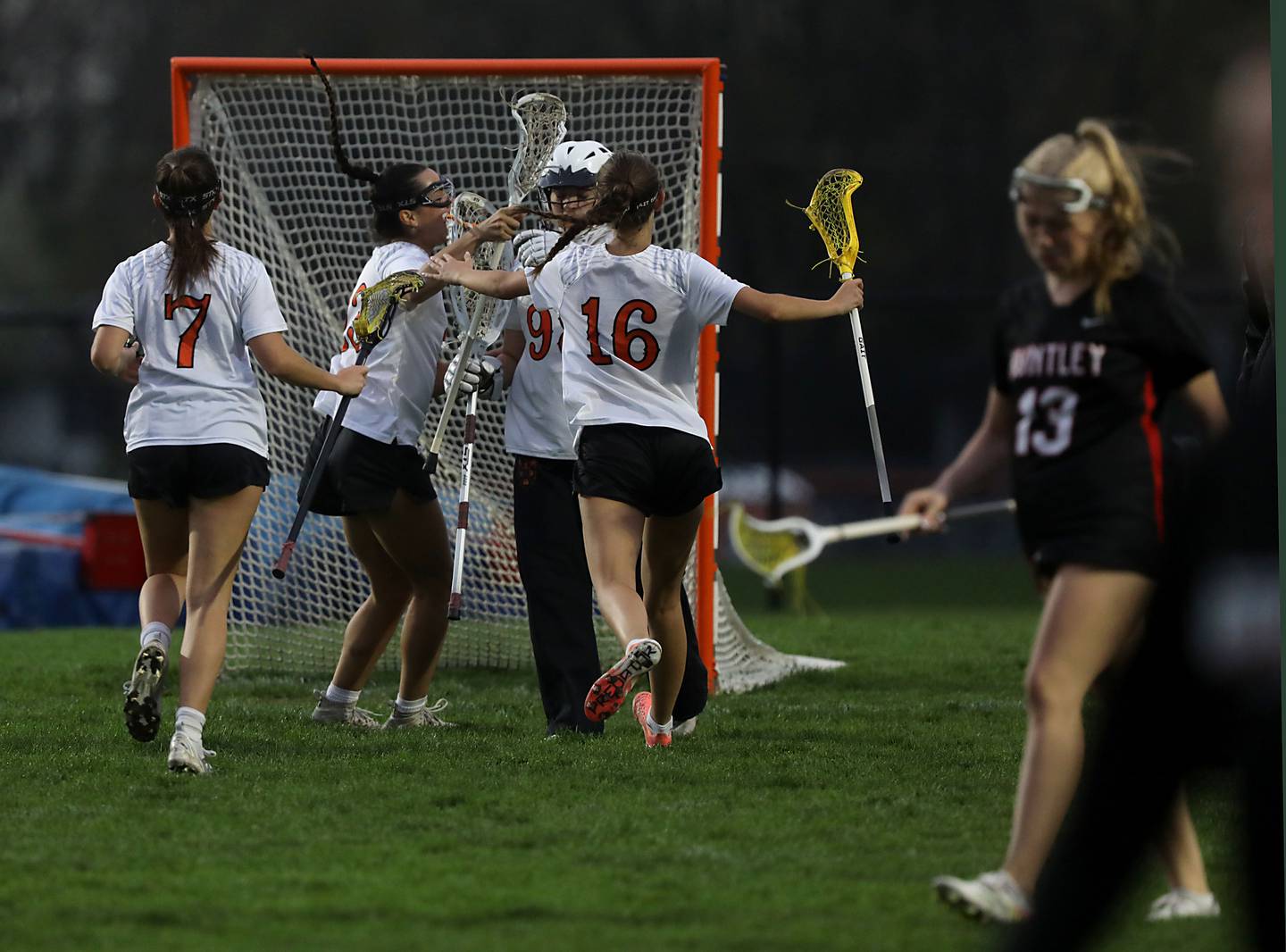 Crystal Lake Central co-op players celebrate their win over Huntley in a Fox Valley Conference girls lacrosse match on Friday, April 17, 2026, at Crystal Lake Central High School.