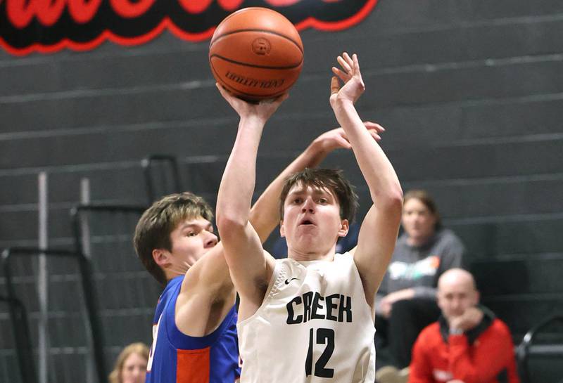 Indian Creek's Jakob McNally gets up a shot in front of Genoa-Kingston's Nathan Skarzynski Wednesday, Jan. 25, 2023, at Indian Creek High School in Shabbona.