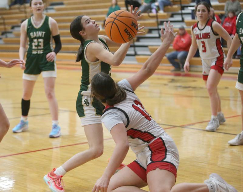St. Bede's Bailey Engles and Henry-Senachwine's Kaitlyn Anderson go after a loose ball on Thursday, Jan. 30, 2025 at Henry-Senachwine High School.