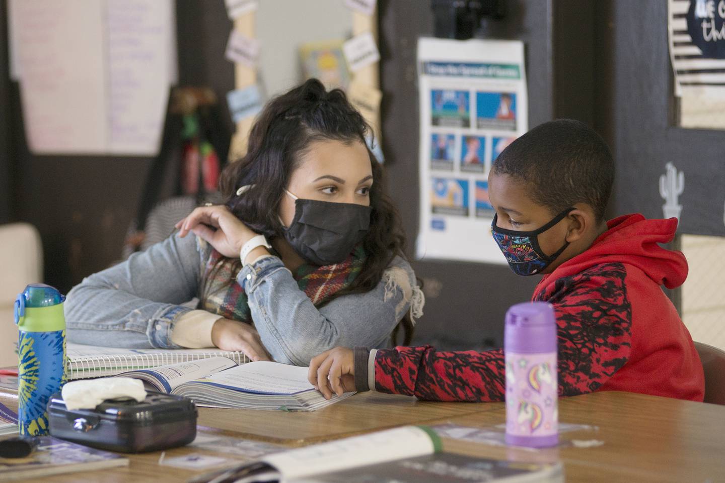 Madison school teacher Alicia McPhillips speaks with a student during a lesson in Dixon.