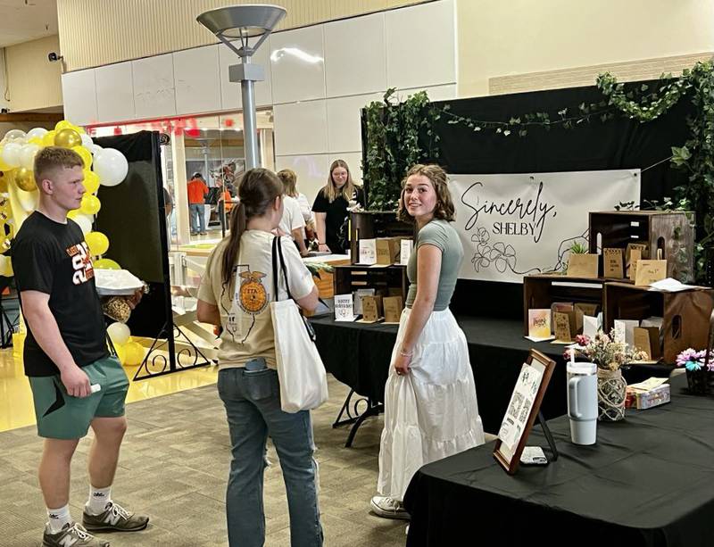 Eastland High School junior Shelby Groezinger greets customers at her business, Sincerely, Shelby, in Sterling's Northland Mall at the Whiteside Area Career Center's CEO program student trade show on April 23, 2025.