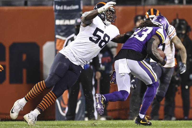 Chicago Bears inside linebacker Roquan Smith defends against Minnesota Vikings running back Dalvin Cook during the second half Monday, Dec. 20, 2021, in Chicago.