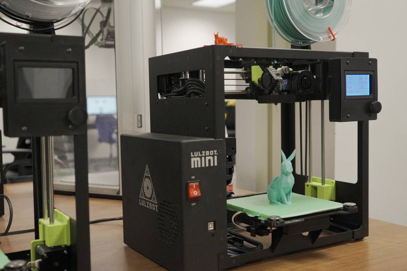Pictured is the 3D printer and a 3D print in the Digital Media Studio at the Joliet Public Library's Ottawa Street branch. In honor of September being Library Card Sign-up Month, the Joliet Public Library is giving patrons a chance to win a free 3D print from the library’s DMS.