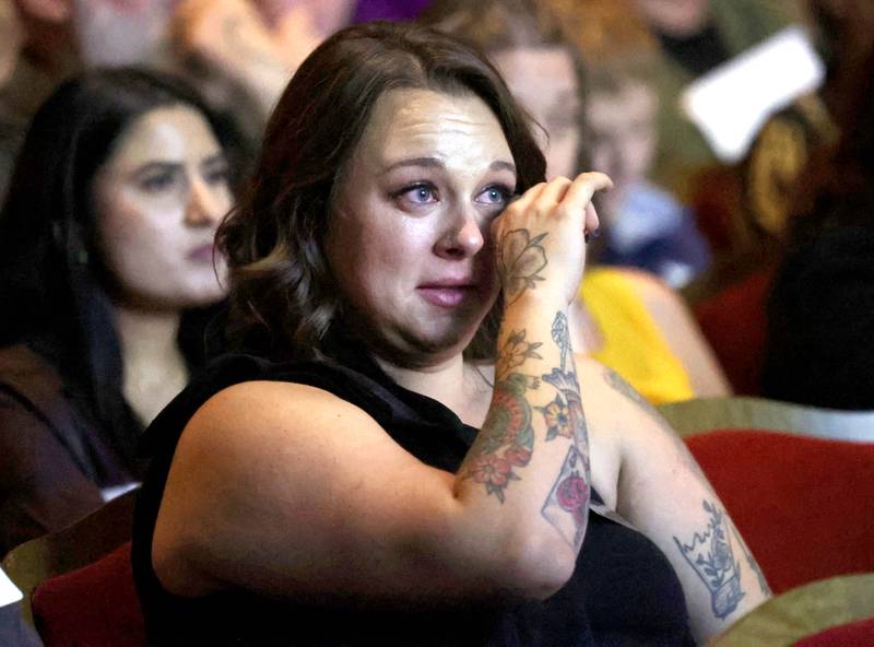 Rylie Loucks-Kues, an Athena Award finalist, becomes emotional as she listens to her presenter Gabby Mancillas talk about her and why she is deserving to be nominated Thursday, Oct. 16, 2025, during the 35th annual Athena and Women of Accomplishment Award Reception at the Egyptian Theatre in DeKalb.