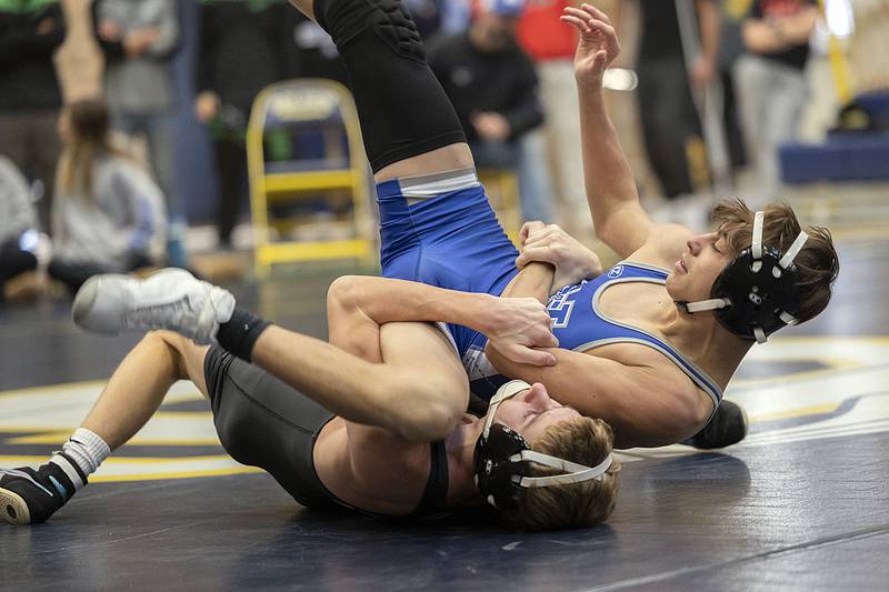 Dixon’s Jack Ragan flips Newman’s Javen Reyes in the 113 pound finals Saturday, Dec. 7, 2024, at the Carson DeJarnatt Invitational in Sterling. Ragan took the win.v
