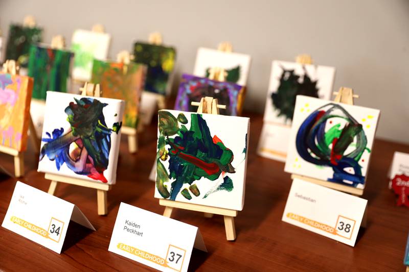 Art work done on small canvasses by early childhood students through adults is on display at the Westmont Public Library.