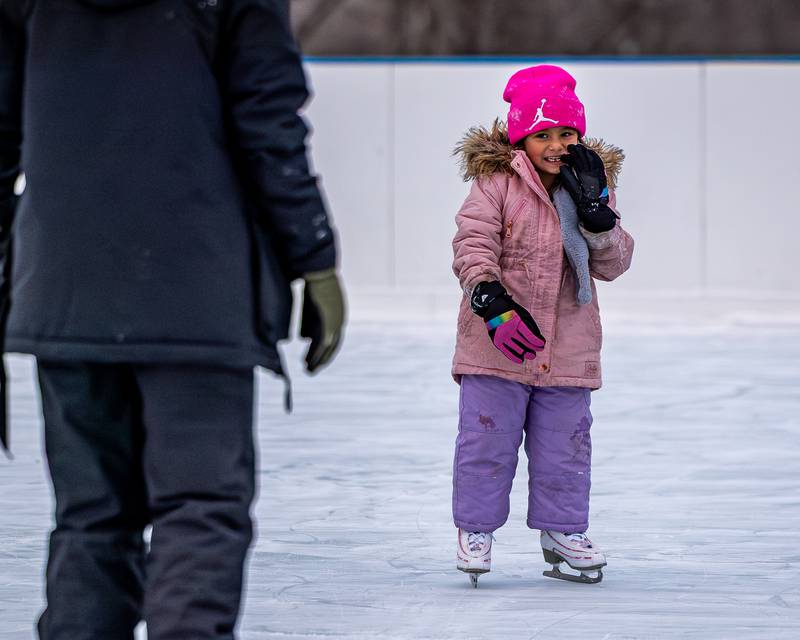 Amilena Policky smiles at dad whilst iceskating at Schweickert Arena's Ice Rink on Tuesday, December 30, 2025, at Washington Park in Peru.