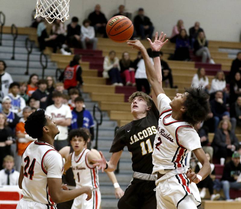 Huntley's Omare Segarra blocks the shot Jacobs' Carter Roper during a Fox Valley Conference boys basketball game Tuesday, Jan. 24, 2023, at Huntley High School.