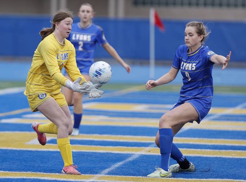 Lyons Township's goalkeeper Anna Bigenwald makes a save during the girl's varsity soccer match between Lyons Township and Wheaton Warrenville South high schools on Thursday, March 27, 2025 in Western Springs.