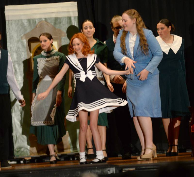 Orphan Annie (Lucy Schneiderman) and  Grace Farell (Zoriah Jenkins) perform a dance number with other cast members during Forreston High School's performance of Annie on Sunday, April 28, 2024.