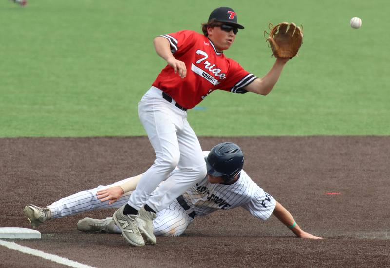 Cary-Grove’s Jacob Duvall is safe at third base as Triad’s Maddux Hunt snags the throw in IHSA Class 3A Third Place Game baseball action at Slammer Stadium in Joliet on Saturday, June 14, 2025.