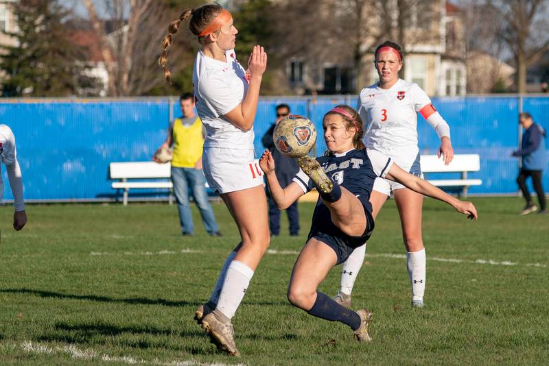 Oswego East's Anya Gulbrandsen (3) plays the ball in the box against Oswego’s Natasha Lopez (10) during a soccer match at Oswego East High School on Thursday, Apr 6, 2023.