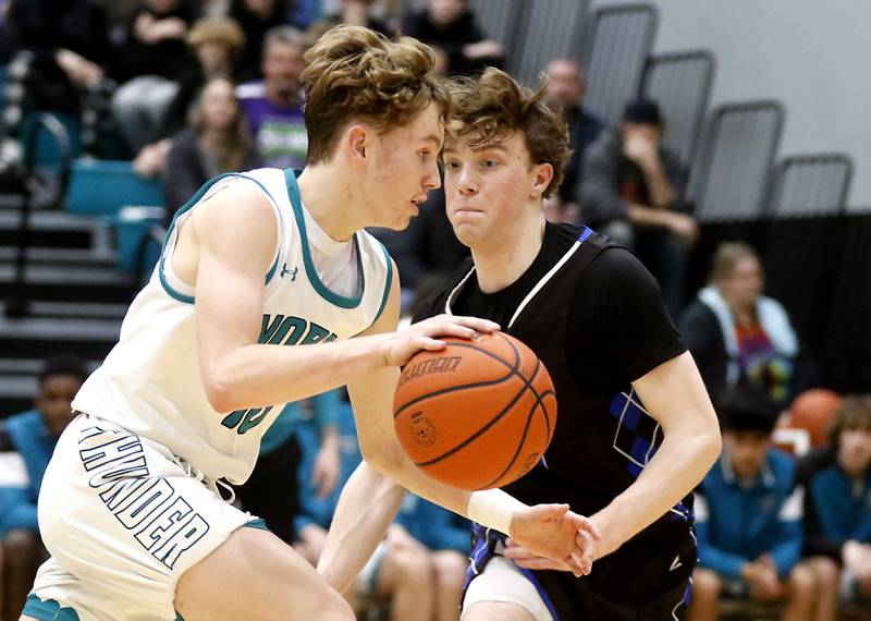 Woodstock North's Trevor Mark brings the ball up the court against Woodstock's Samuel Chapman during a Kishwaukee River Conference boys basketball game on Friday, Jan. 5. 2024, at Woodstock North High School.