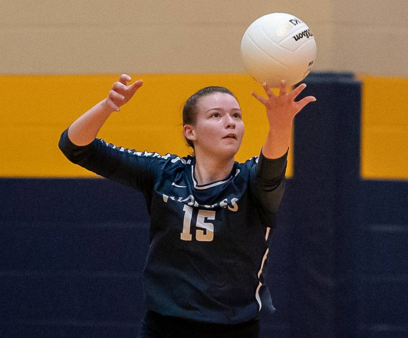 Oswego East's Megan Maier (15) serves the Ball against Neuqua Valley during the Neuqua Valley 4A regional final volleyball match at Neuqua Valley High School in Naperville on Thursday, Oct 27, 2022.