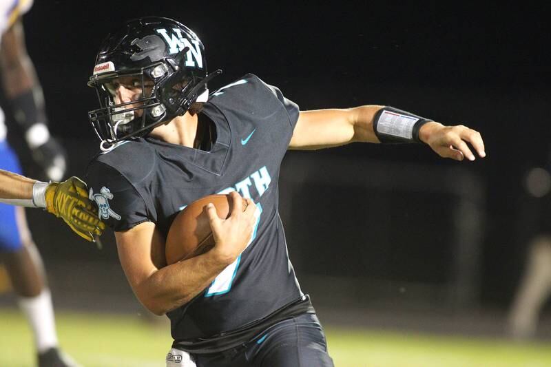 Woodstock North’s Parker Halihan runs the ball against Johnsburg in varsity football on Friday Sept. 27, 2024, at Woodstock North High School in Woodstock.