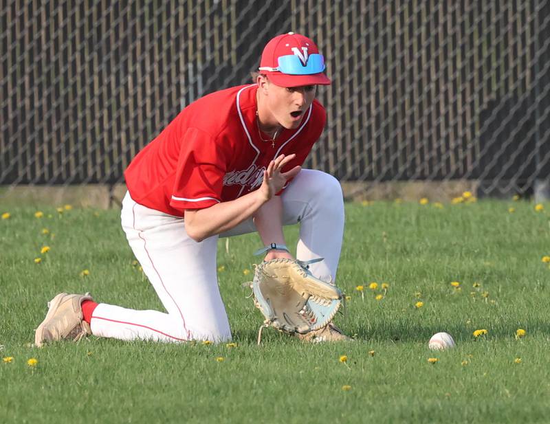 Naperville Central's Ryan Gervase fields a ball in left field Monday, April 28, 2025, during their game at DeKalb High School.