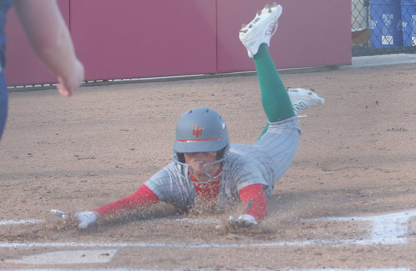 L-P's Karmen Piano slides safely into home to score the teams first run against Princeton on Tuesday, March 25, 2025 at the L-P Athletic Complex in La Salle.