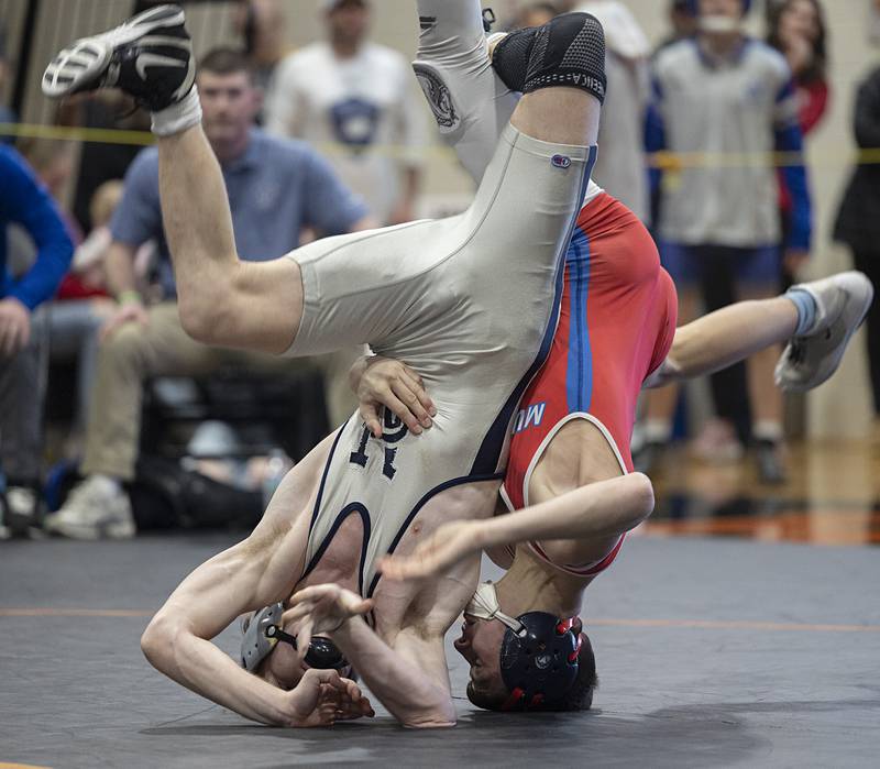 Newman’s Zhyler Hansen and Morrison’s Eli Modglin roll over in the 126 pound first place match Saturday, Feb. 14, 2026, during the Class 1A wrestling sectionals in Byron.