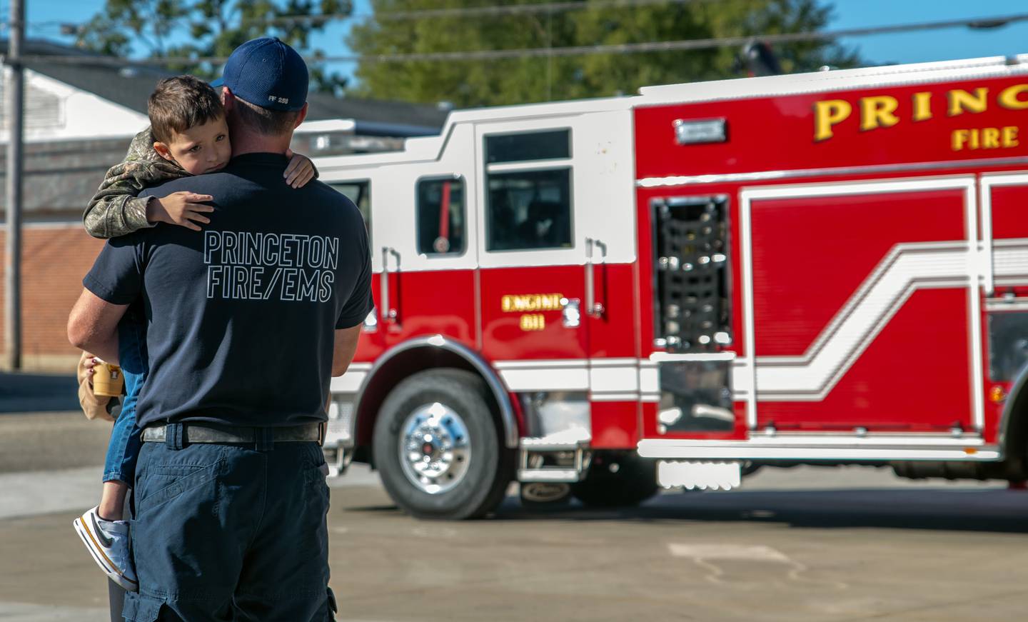 The open house featured a children’s firefighter-themed obstacle course. Children carried a fire hose, crawled through a tube, moved around pylons, dragged a rescue mannequin, and knocked down inflatable flames with a water hose.