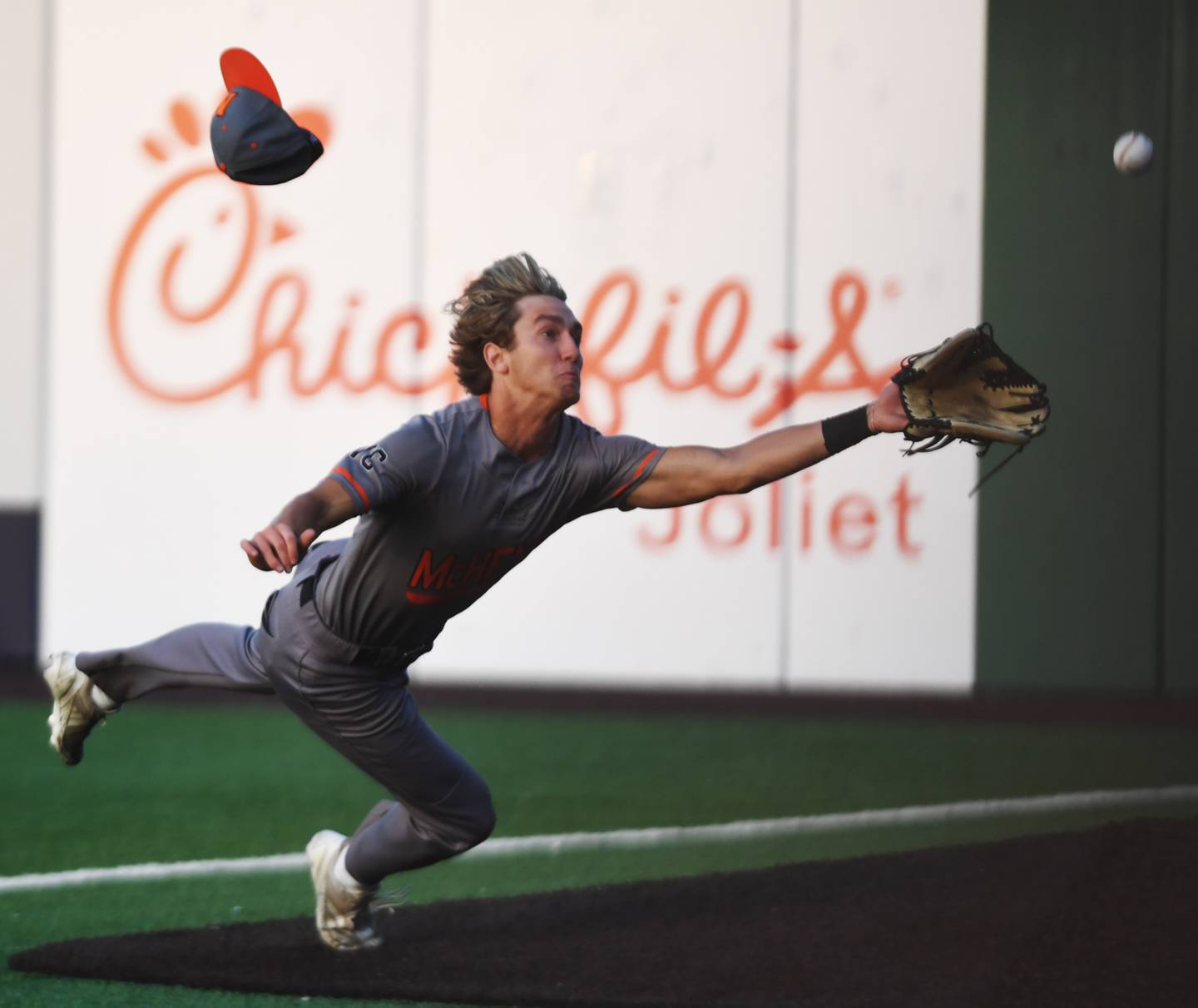 McHenry right fielder Jeffry Schwab makes an attempt at a fly ball that went foul, but he was unable to make the catch, during the Class 4A state baseball title game at Slammers Stadium on Saturday, June 14, 2025 in Joliet.