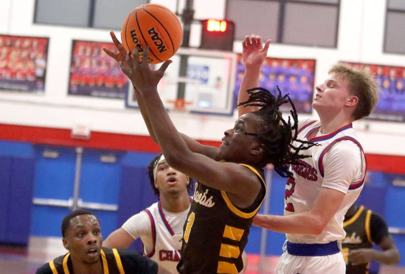 Jacobs’ Malachi Bell works under the hoop in varsity boys basketball on Friday, Dec. 12, 2025, at Dundee-Crown High School in Carpentersville.